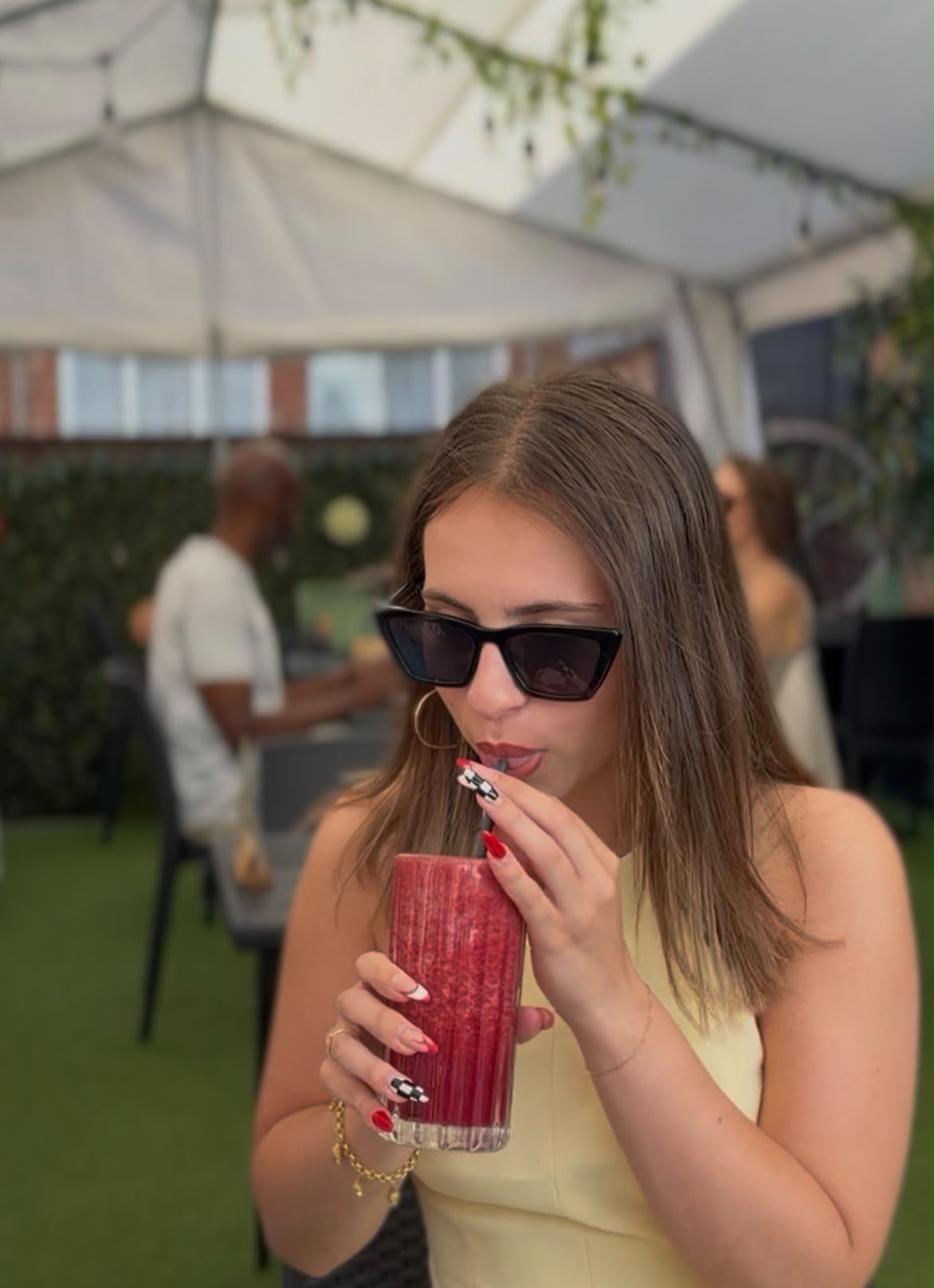 Guest enjoying a fresh berry smoothie on the rooftop terrace at Zest, York